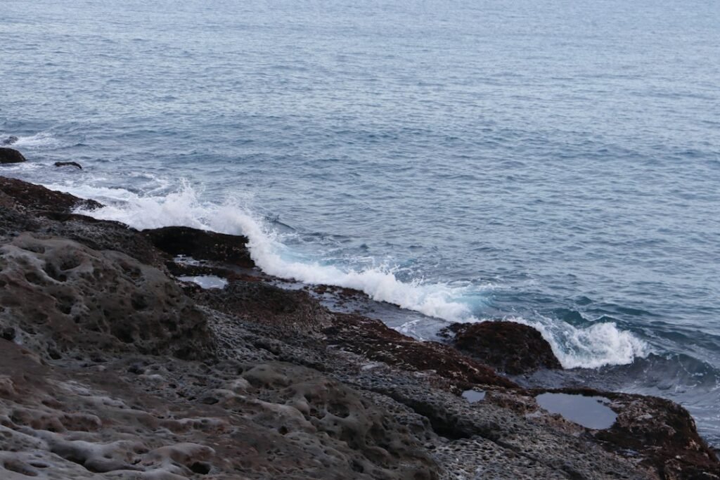 Archival photograph of ocean waves at Yehliu Geopark on Taiwan's northern coast; not an image of Typhoon Champi in October 2026.