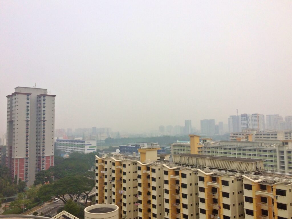 Archive photograph from October 2015 showing Singapore buildings partly obscured by haze; not a photograph of the October 2026 fires