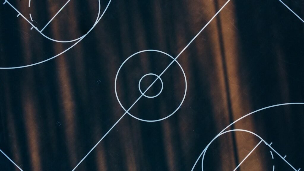 Empty basketball court with painted markings and long shadows; illustrative archival photograph, not Spurs–Mavericks game action