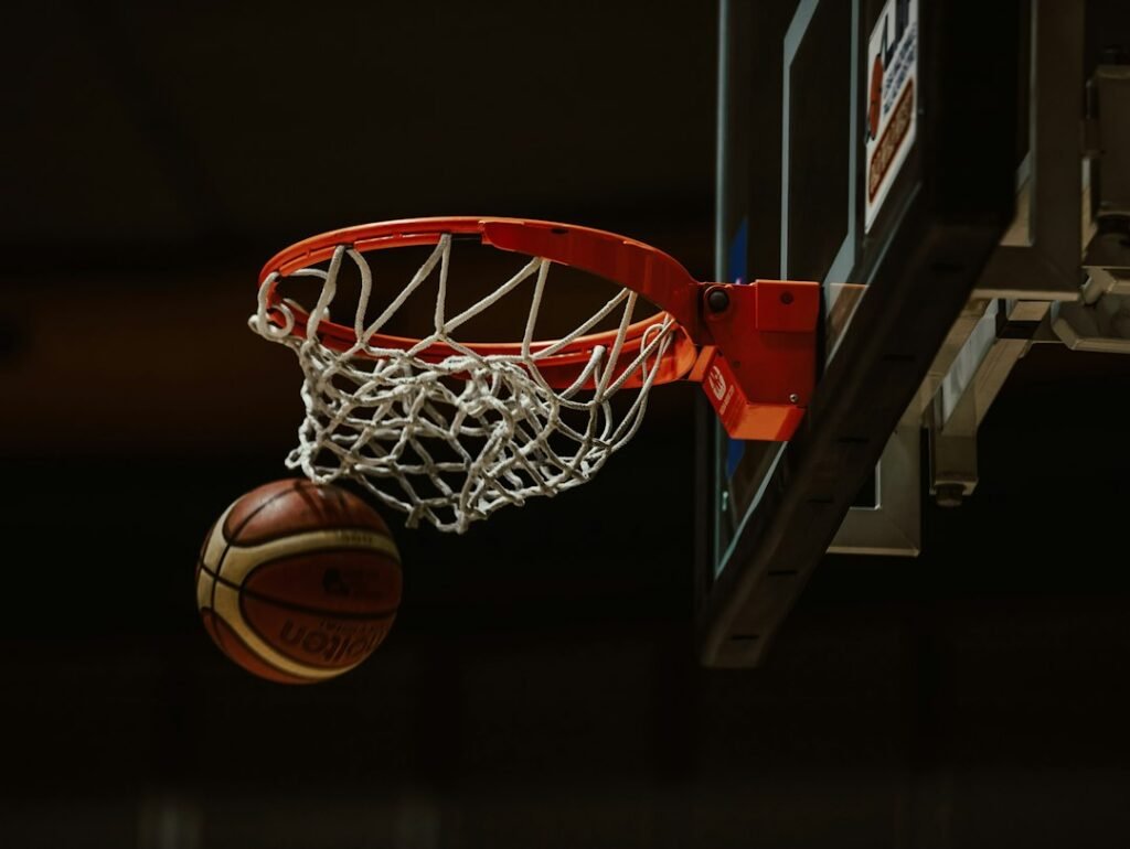 Basketball passing through a hoop in an indoor court; illustrative archival image, not from the October 24, 2026 Suns–Warriors game