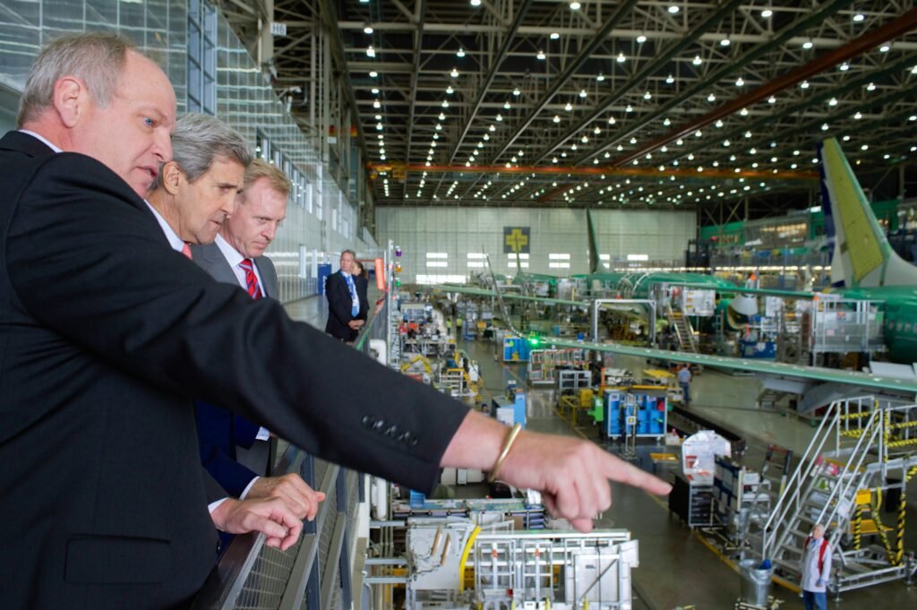 Archival May 2015 view of Boeing 737 assembly line in Renton, Washington, with officials observing factory floor; not the October 2026 earnings event.