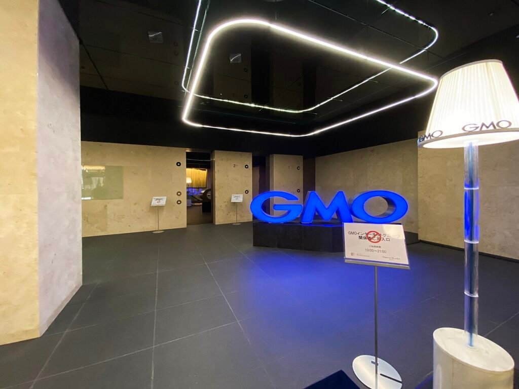 GMO sign inside the company's Shibuya office lobby in Tokyo, photographed in 2019; archival image, not the 2026 cyberattack