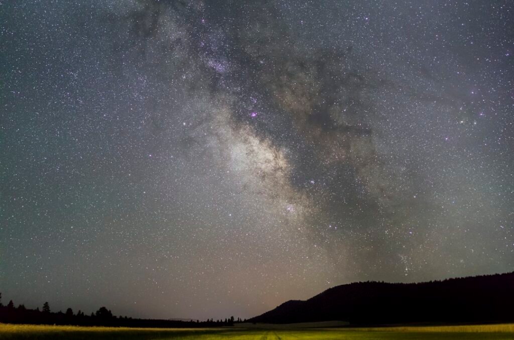 Milky Way over a dark landscape, illustrative stock photo; not an image of dwarf-planet candidate 2026 ED138