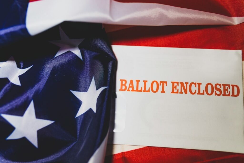 Illustrative stock photograph of a mail-in ballot with an American flag; not a photograph of Alaska's 2026 Senate election.