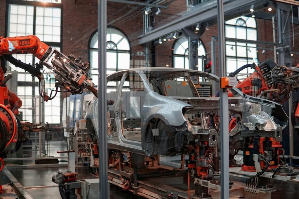 Illustrative car assembly line with industrial robots; not verified as a Volkswagen facility