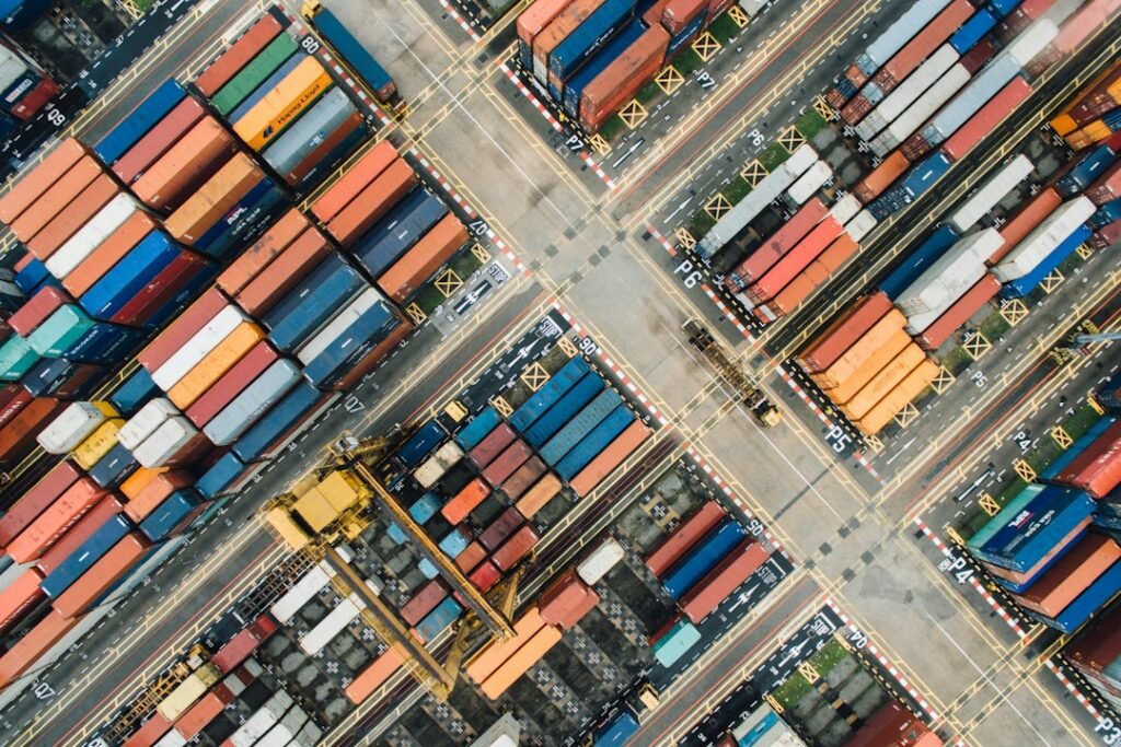 Illustrative photograph of cargo ships and containers at a port; not a photograph of the October 30, 2026 dockworkers' demonstrations.