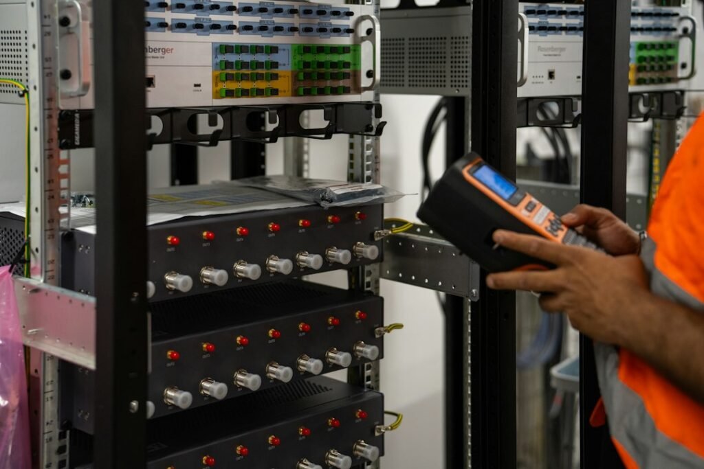 Technician inspecting data center server racks; illustrative image, not an STMicroelectronics facility