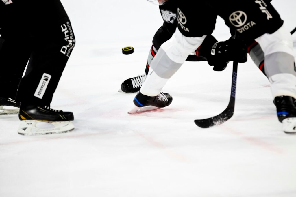 Players competing in an ice hockey game, generic illustrative photograph not showing the October 29, 2026 Sharks-Canucks matchup.