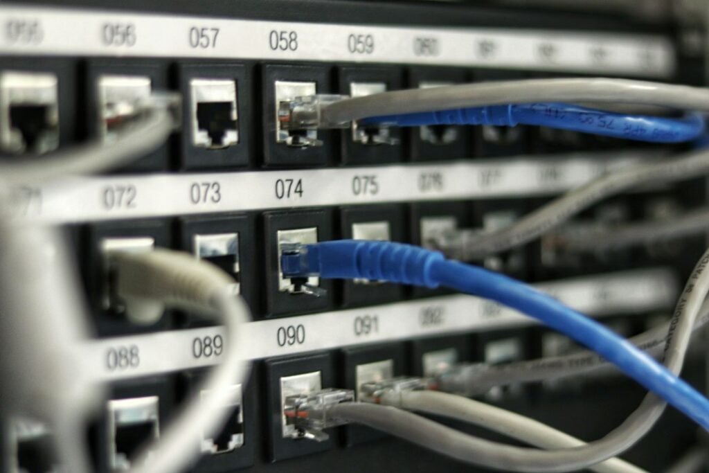 Illustrative photograph of network equipment and cabling; not Mistral AI infrastructure