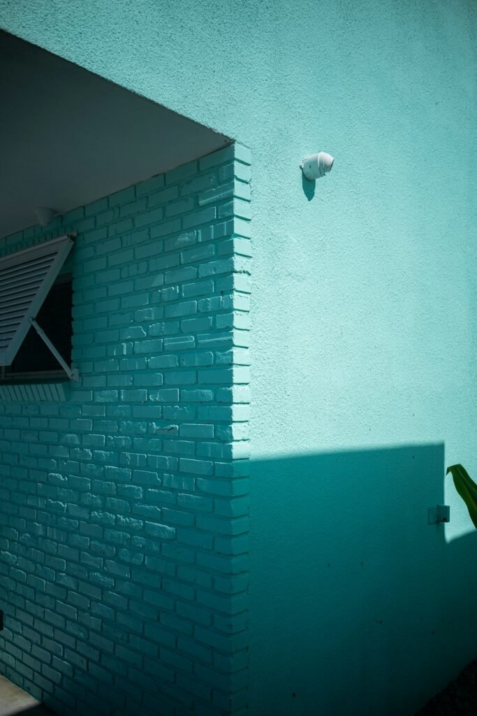 Illustrative exterior security camera mounted on a building wall; not an ADT installation