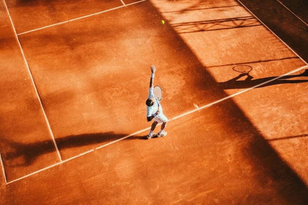 Tennis player striking a ball on court; illustrative archival photograph, not the 2026 Almaty Open final