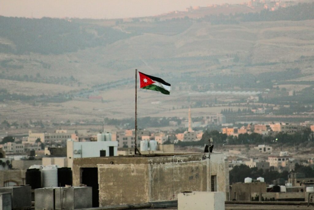 Archival photograph of Jordan's national flag; illustrative image, not a scene from the October 2026 Karak church attack.