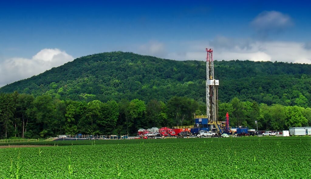 Natural gas drilling rig in a green valley along Pennsylvania Route 87 in the Marcellus Shale region, photographed in 2012