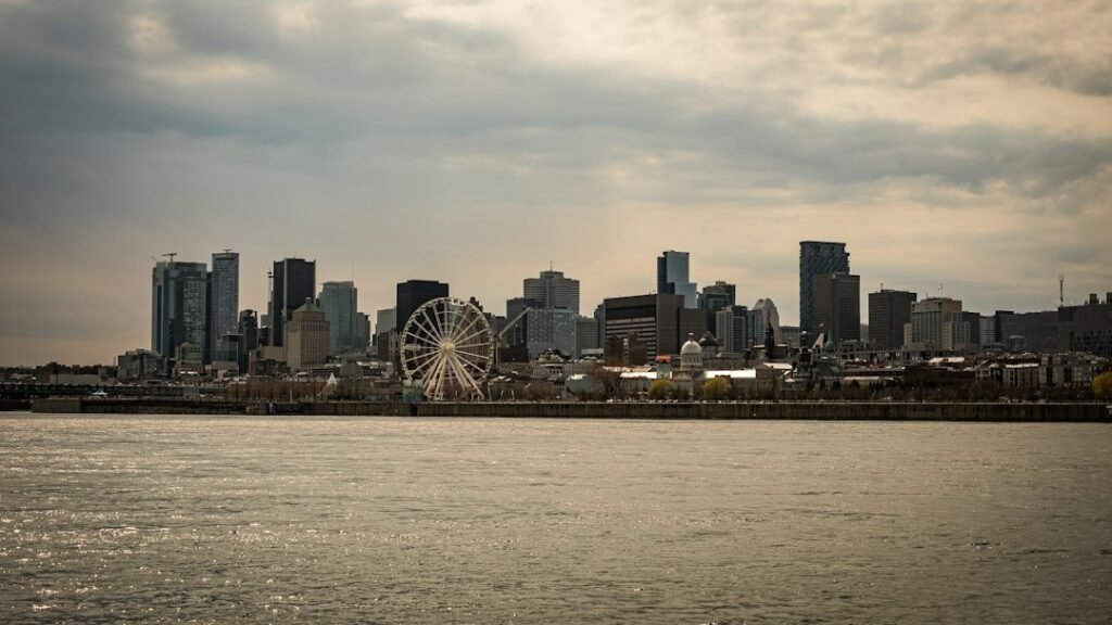 Illustrative photograph of Montréal skyline and waterfront with Ferris wheel, the host city for the 29–30 October 2026 Canada–EU summit; not a photo of the summit