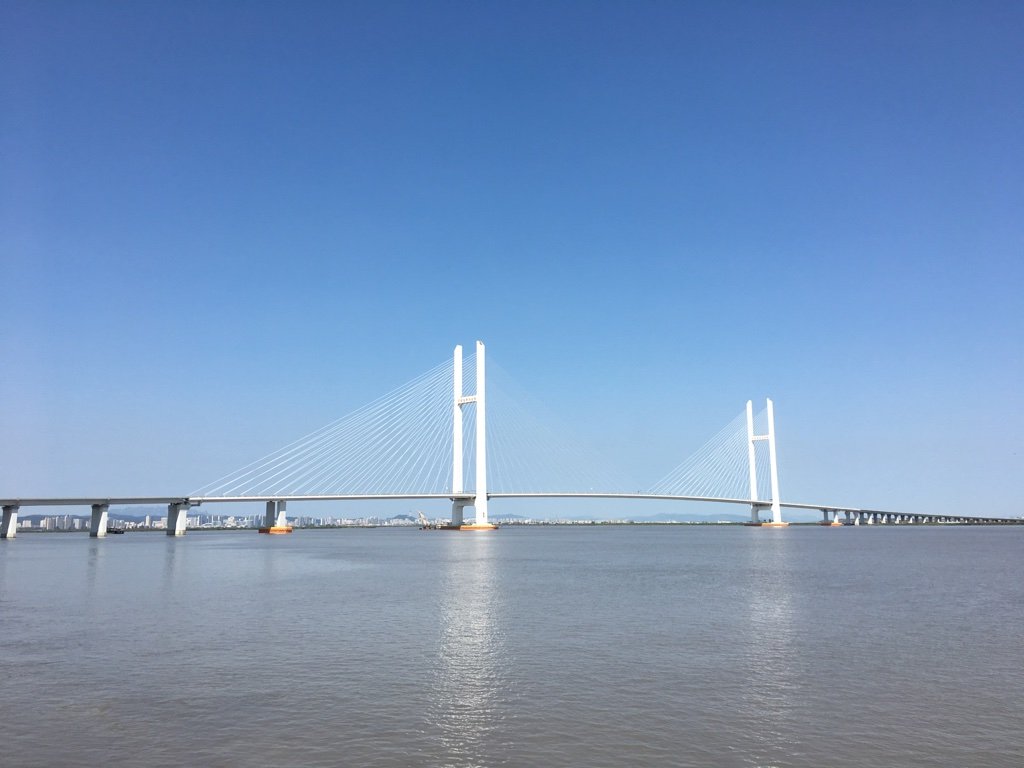 Archival 2016 view of the New Yalu River Bridge spanning the Yalu River between China and North Korea; no people or 2026 visit depicted.