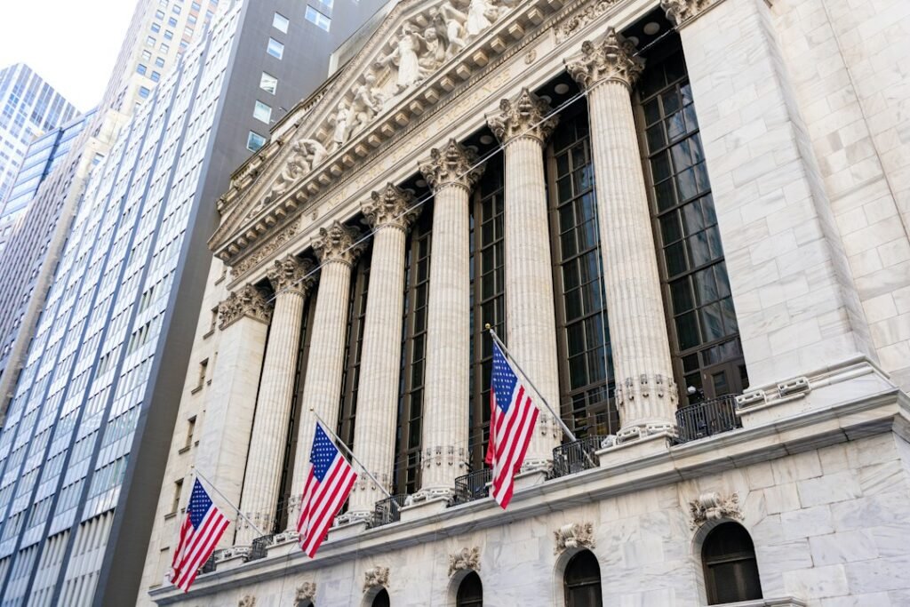 Exterior of the New York Stock Exchange with United States flags; illustrative photograph, not a view of October 30, 2026 trading